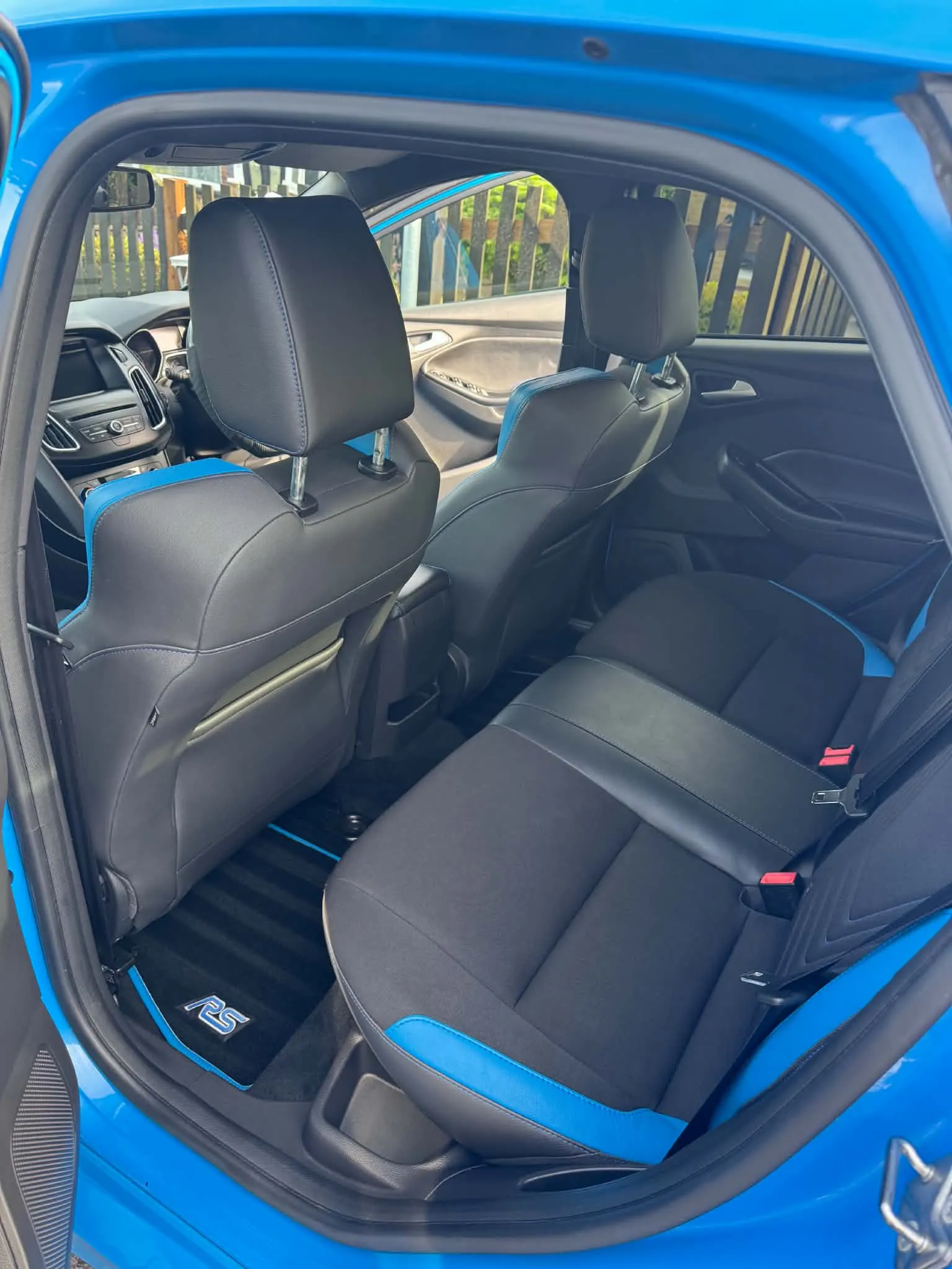 Blue and black rear seats of a Ford Focus RS deep cleaned and protected