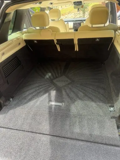 Rear seats and boot carpet of a large SUV after deep cleaning and extraction